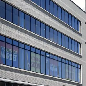Modern Multi-story Building With Durable Facade And Large Windows Showcasing Sto Corp&rsquo;s Resilient Wall System.