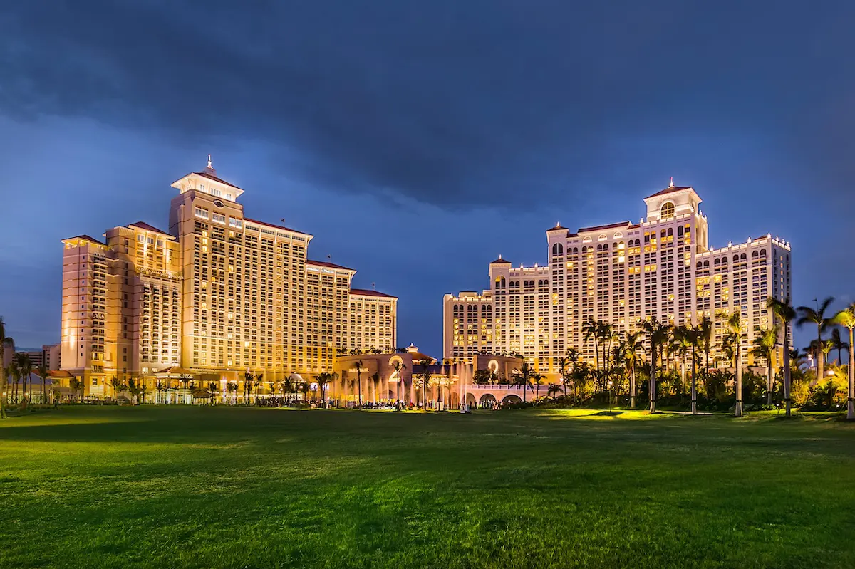 Night view of the Baha Mar resort showing illuminated hotel towers and fa&ccedil;ade systems designed for durability and performance.