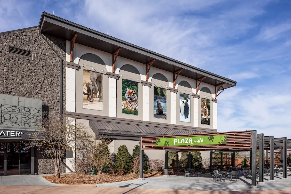 Commercial building with textured cladding installed over a drained and back-ventilated rainscreen system