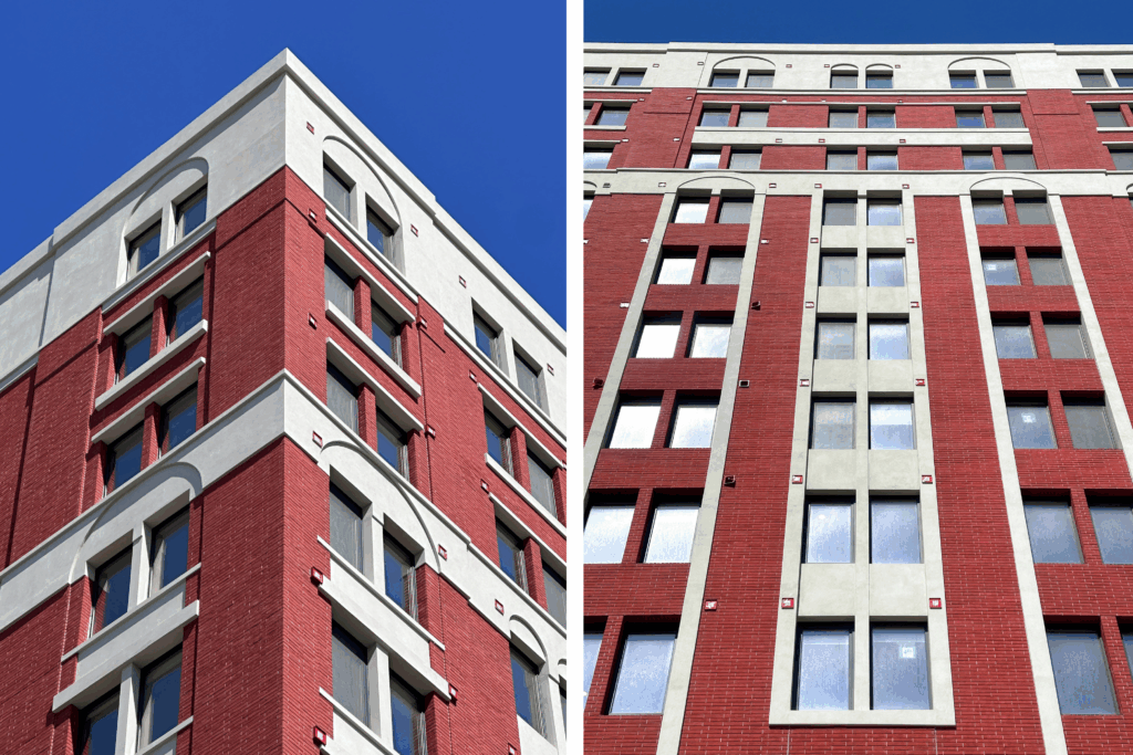 Multi-story building facade with red brick-look cladding and light trim, illustrating an urban exterior retrofit with traditional architectural character.
