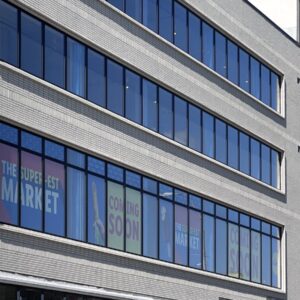 Modern Multi-story Building With Durable Façade And Large Windows Showcasing Sto Corp’s Resilient Wall System.