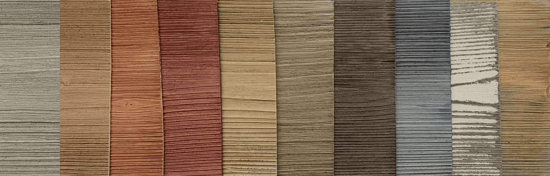 Row of wood-grain finish samples in multiple colors showcasing StoColor Wood Stain dual-tone options.