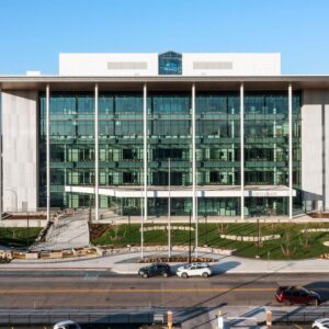 Kalamazoo Justice Center. Exterior View Of A Modern Multi-story Building With A Glass Curtain Wall And Light-colored Rainscreen Cladding Panels.